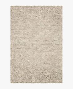 a beige rug with an intricate design on it