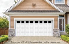 an image of a house with two garage doors