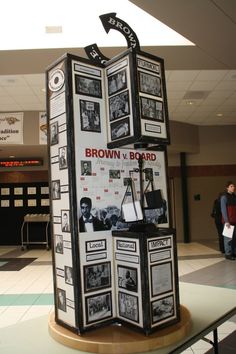 a display in the middle of an airport with information about brown v board on it