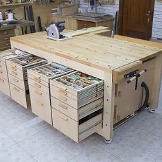 a workbench with many drawers and tools