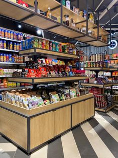 a grocery store filled with lots of food and condiments on shelves next to each other