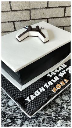 a birthday cake with a cross on top