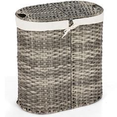 a round wicker laundry hamper with white linings and an inner liner for storage