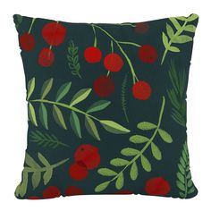 a green pillow with cherries and leaves on it