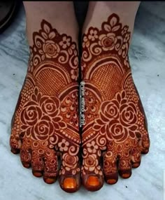 the feet are decorated with henna and flowers