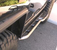 the front end of a vehicle with a tire guard