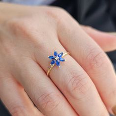 💎Add a touch of elegance to your jewelry collection with this stunning 14K Gold Sapphire Flower Ring. The intricate design features a dazzling Diamond Statement Ring centerpiece surrounded by beautiful Marquise Blue Gemstones. This Unique Ring for Women is the perfect September Birthstone accessory and makes a meaningful Birthday Gift that will be cherished for years to come. 💎We can make our product on the list in the colored stones you want. Feel free to send us a message so we can check. 💎 Blue Gemstone Flower Ring, Elegant Blue Diamond Flower Ring, Elegant Blue Flower Ring As Gift, Blue Flower Rings For Formal Occasions, Blue Flower Ring For Wedding Fine Jewelry, Elegant Flower Shaped Birthstone Rings, Elegant Flower Shape Birthstone Rings, Elegant Flower-shaped Birthstone Rings, Elegant Diamond Flower Ring With Birthstone