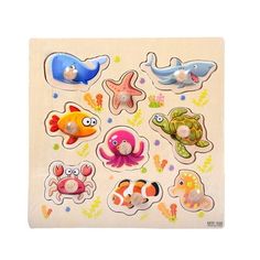 a wooden puzzle with different types of sea animals