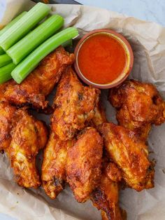 chicken wings with celery sticks and dipping sauce