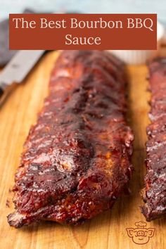 the best bourbon bbq sauce on a wooden cutting board with two ribs in it