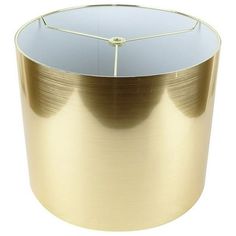 a round metal table with a white top and gold trim on the bottom, in front of a white background