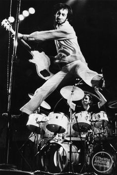 an image of a man that is on the stage with his legs in the air