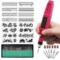 a hand holding a pink pen with various designs and tools in front of the image