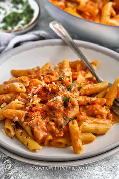 Penne alla vodka is an easy Italian favorite! With a creamy vodka tomato sauce, tender penne pasta and smoky pancetta, you'll never believe it's a 30 minute meal!