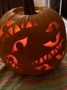 a carved pumpkin sitting on top of a table