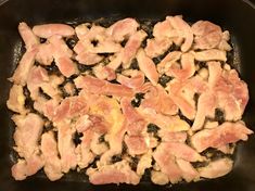 chicken and bacon cooking in a skillet