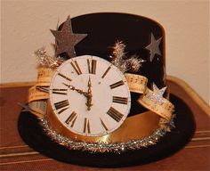 a top hat with a clock and stars on it