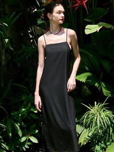 This is a modern and casual sleeveless dress by FACADE PATTERN that is made out of high quality and sturdy fabric. With unique design detail and trendy mood, you can style it for your clean and casual daily outfit.- Adjustable string on the back- Light and cool touch of fabric- Maxi length and sleeveless design Black Slip Dress With Side Slits, Chic Black Slip Dress With Side Slits, Sleeveless Sleek Maxi Dress, Sleek Midi Slip Dress For Summer, Sleek Summer Midi Slip Dress, Chic Longline Summer Dress, Sleek Midi-length Slip Dress For Summer, Sleek Midi-length Summer Slip Dress, Black Cotton Sleeveless Summer Dress