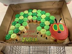 a birthday cake in the shape of a caterpillar