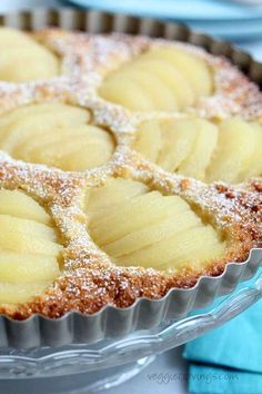 a pie with several slices cut out of it and powdered sugar on the top