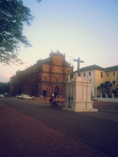 an old church in the middle of a street