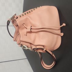 Beautiful Peach Leather Bag With Leather Drawstring Top - Gold Brads Down The Side - Gold Rebecca Minkoff Tag. Adjustable Straps With Snaps. Lobster Clasps. Metallic Rose Gold Interior. N4143 14" Drop Strap At The Smallest. Bottom Is 9" X 6" 9" Tall Pink Leather Bucket Bag, Luxury Pink Pouch For Everyday Use, Trendy Leather Pouch With Detachable Strap, Trendy Leather Shopping Pouch, Blush Travel Pouch Bag, Pink Leather Shoulder Bag With Dust Bag, Pink Shoulder Bag With Metal Hardware For Shopping, Leather Bucket Pouch For Shopping, Leather Shoulder Bag Pouch For Errands