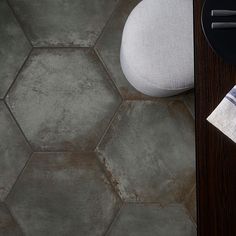 a close up of a table with a plate and napkin on it next to a chair