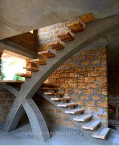 the stairs are made out of concrete and wood