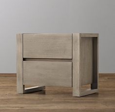 the side table is made out of wood and has an open drawer on one side