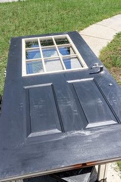 an old door is being painted black