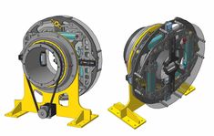 the front and side view of a machine with gears on it's sides, in yellow