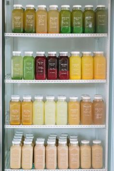 many different types of juices are on shelves