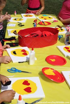 children are sitting at a table with paper plates and crafting utensils on it