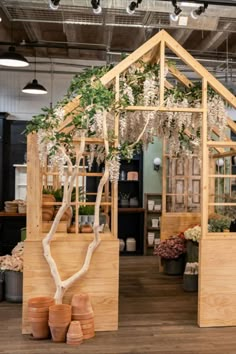 a house made out of wood and plants