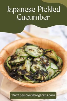 japanese pickled cucumber in a wooden bowl with chopsticks on the side