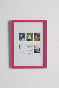 a pink and white frame with photos on it, hanging on the wall in front of a white wall