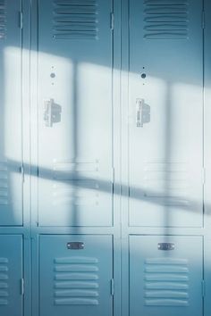 a row of blue lockers sitting next to each other