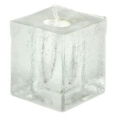 an ice cube candle holder on a white background