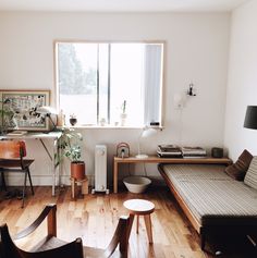 the living room is clean and ready to be used as a work space or office