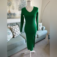 New With Tags Chic Green V-neck Sweater Dress, Chic Green Knit Midi Dress, Green Knit Midi Dress For Spring, Green Knit Party Dress, Elegant Green Knit Midi Dress, Green Stretch Knit Sweater Dress, Green Stretch Midi Sweater Dress, Stretch Knit Green Sweater Dress, Green Midi Length Stretch Sweater Dress