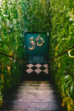 the stairs are covered in green plants and have numbers on each step to make it look like they're going down