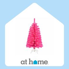 a pink christmas tree is in the shape of a house with words at home on it