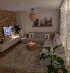 a living room filled with furniture and a flat screen tv