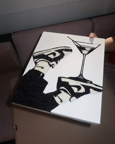 a painting with two martini glasses on it