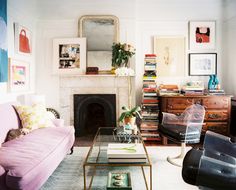 a living room filled with furniture and a fire place