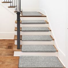 the carpeted stair treads in this home are clean and ready to be used