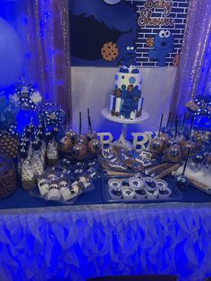 a table topped with lots of cakes and desserts