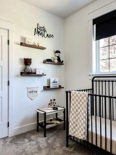 a baby's room with a crib and shelves