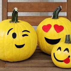 two yellow pumpkins with faces painted on them