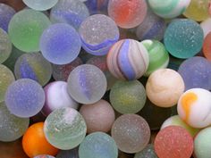 there are many different colored marbles together